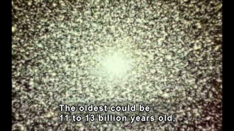 Dense points of light on a black background. Caption: The oldest could be 11 to 13 billion years old,