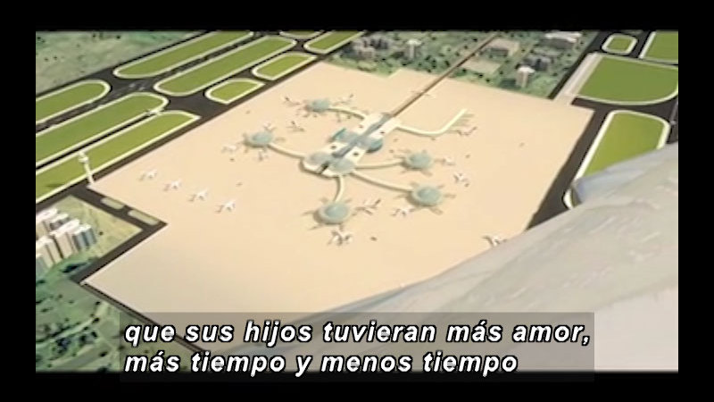 Model of an airport surrounded in green spaces. Spanish captions.