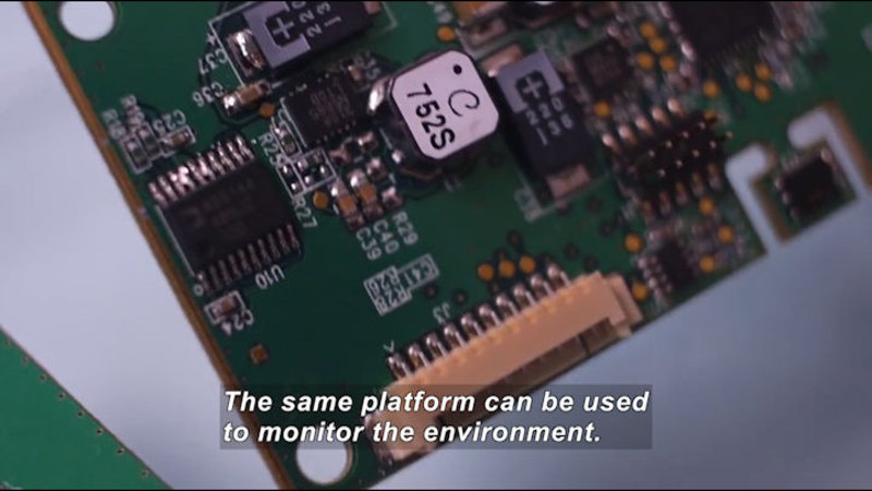 Closeup of a circuit board. Caption: The same platform can be used to monitor the environment.
