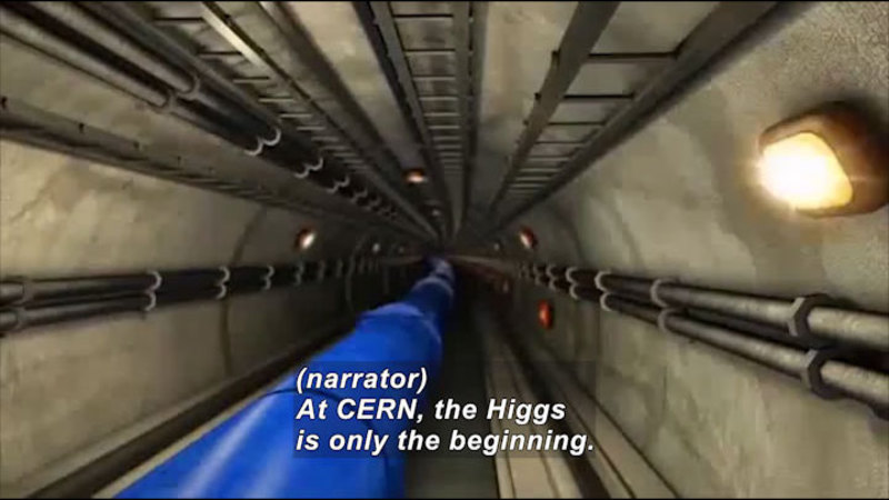Circular tunnel with pipe conduit along the walls and a large, central tube. Caption: (narrator) At CERN, the Higgs is only the beginning.