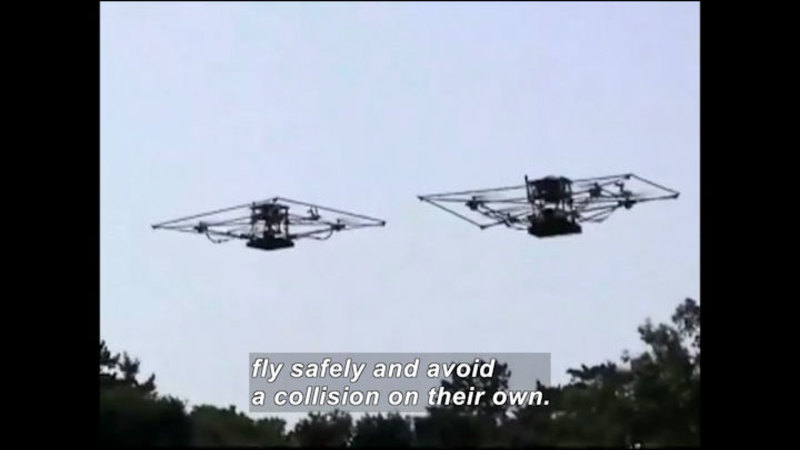 Two rectangular drones flying in the air. Caption: fly safely and avoid collision on their own.