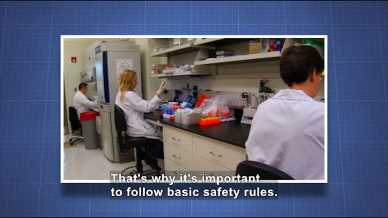 People working in a science lab. Caption: That's why it's important to follow basic safety rules.