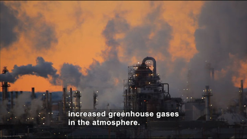 Industrial plant with smokestacks emitting pollutants. Caption: Increased greenhouse gases in the atmosphere.