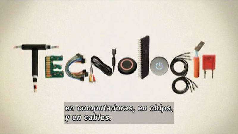 The word "Technologie" spelled out in computer chips and cables. Spanish captions.
